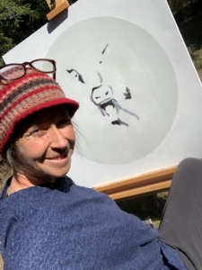 Pam Roberts painting during Artist Residency