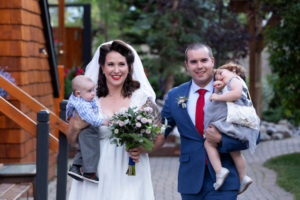 A couple and their children during an elopement ceremony in Canmore, Alberta.