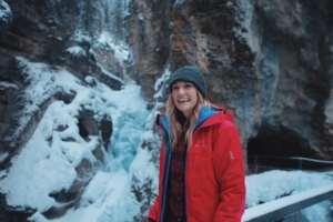 A smiling woman during a winter hike near Canmore.