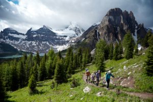 Hiking on the Banff Highline with Lake Magog and Mt Assiniboine in the background